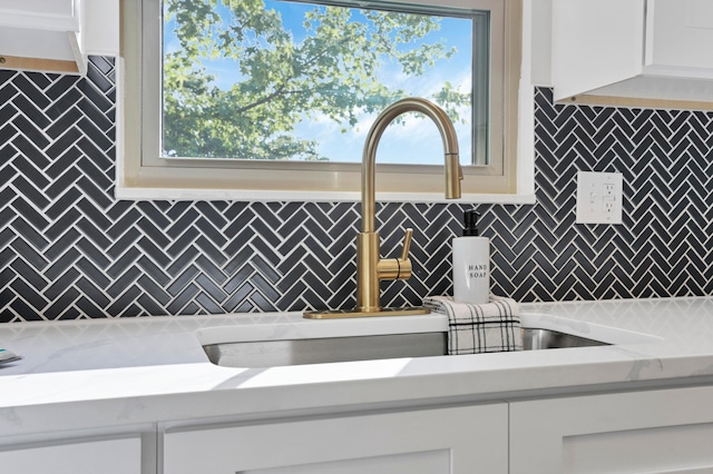 8139 Storrow Dr, Westerville, OH 43081 - kitchen view of decorative backsplash, light countertops, and white cabinets