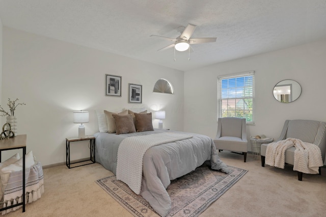 8139 Storrow Dr, Westerville, OH 43081 - bedroom with light colored carpet, a ceiling fan, and a textured ceiling