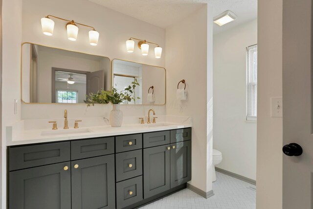 8139 Storrow Dr, Westerville, OH 43081 - full bathroom with double vanity, a ceiling fan, tile patterned flooring, and a shower