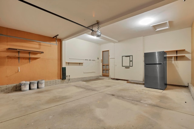 8139 Storrow Dr, Westerville, OH 43081 - garage with freestanding refrigerator and a garage door opener