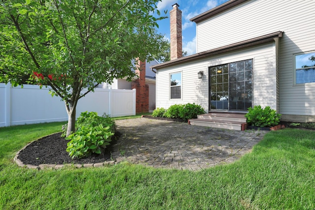 8139 Storrow Dr, Westerville, OH 43081 - rear view of house with a chimney and a patio area