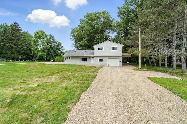 4615 County Road 23, Cardington, OH 43315 - view of front facade featuring a garage, driveway, and a front yard