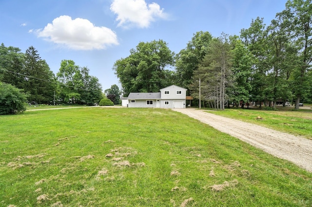 4615 County Road 23, Cardington, OH 43315 - view of grassy yard featuring driveway and an attached garage