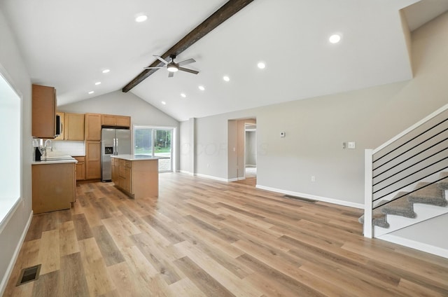 4615 County Road 23, Cardington, OH 43315 - kitchen with stainless steel fridge with ice dispenser, beamed ceiling, light countertops, a ceiling fan, and open floor plan