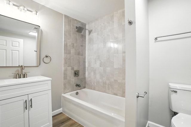 4615 County Road 23, Cardington, OH 43315 - bathroom featuring vanity, washtub / shower combination, and wood finished floors