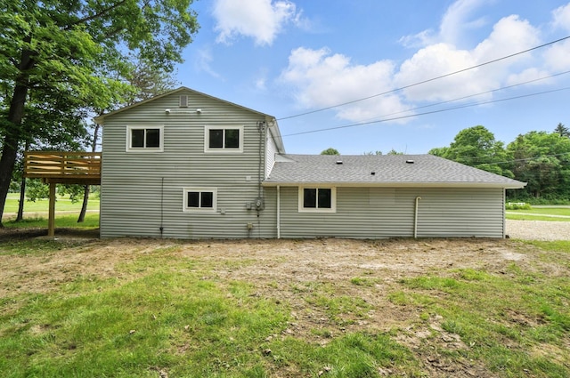4615 County Road 23, Cardington, OH 43315 - back of house with a wooden deck, a lawn, and a shingled roof