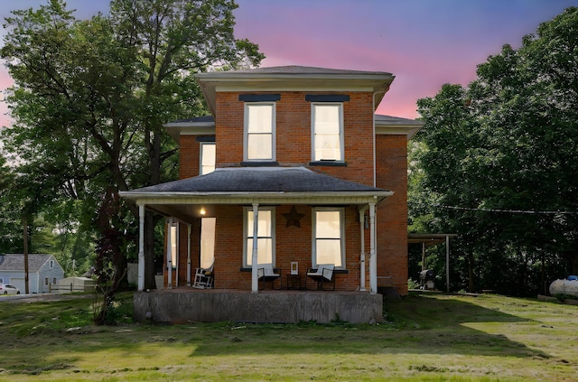 1871 Galloway Rd, Galloway, OH 43119 - traditional style home featuring a porch, brick siding, and a front lawn