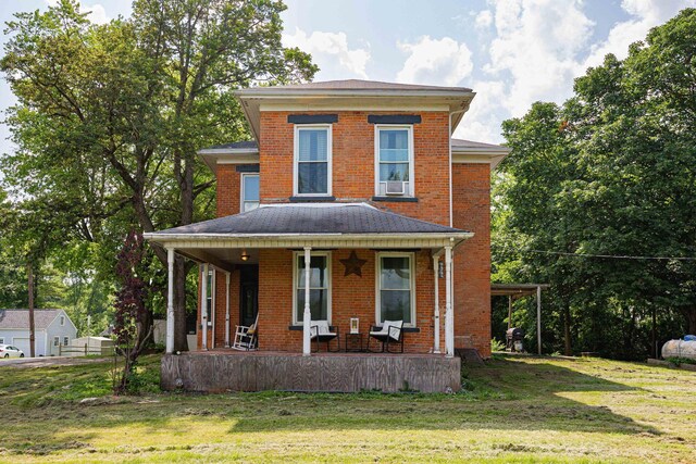 1871 Galloway Rd, Galloway, OH 43119 - american foursquare style home with covered porch, a front yard, and brick siding