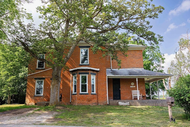 1871 Galloway Rd, Galloway, OH 43119 - view of front facade with brick siding and a front lawn