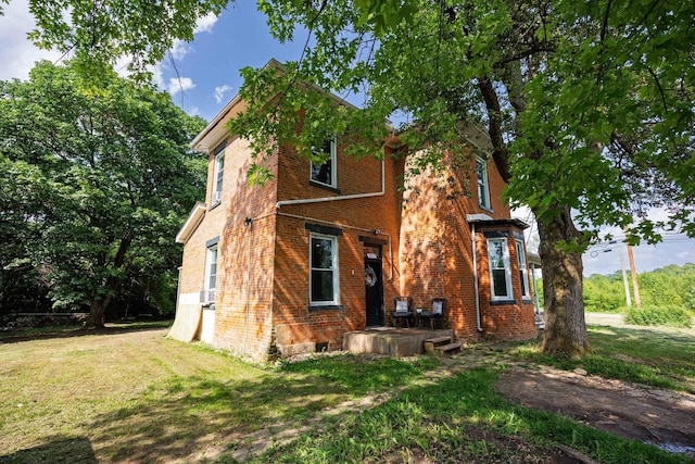 1871 Galloway Rd, Galloway, OH 43119 - view of property exterior featuring brick siding and a lawn