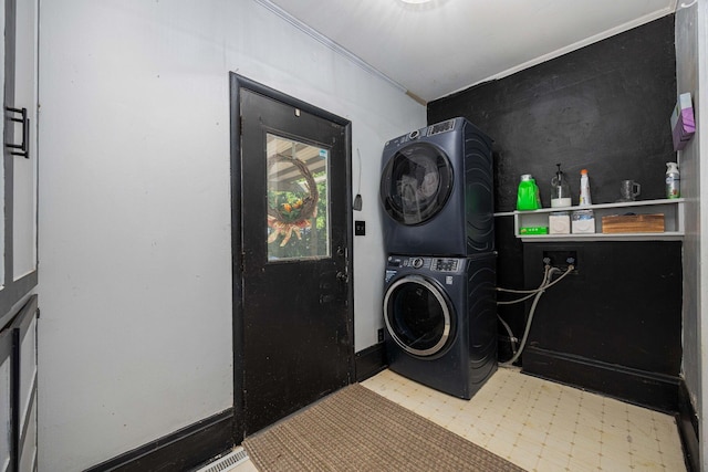 1871 Galloway Rd, Galloway, OH 43119 - laundry room with stacked washer / drying machine, tile patterned floors, and ornamental molding