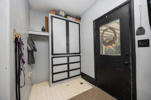 1871 Galloway Rd, Galloway, OH 43119 - entryway with tile patterned floors and crown molding