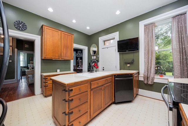 1871 Galloway Rd, Galloway, OH 43119 - kitchen featuring dishwashing machine, light countertops, brown cabinets, recessed lighting, and light floors