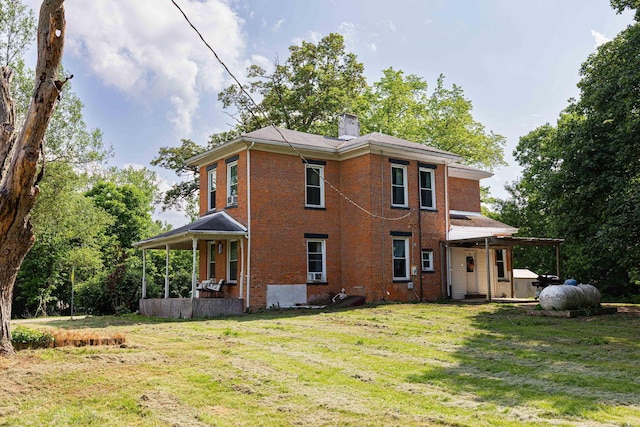 1871 Galloway Rd, Galloway, OH 43119 - rear view of property with a yard, brick siding, and a chimney