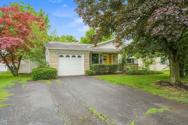 401 Smith Rd, Columbus, OH 43228 - view of front of home featuring a garage, stone siding, driveway, and a shingled roof