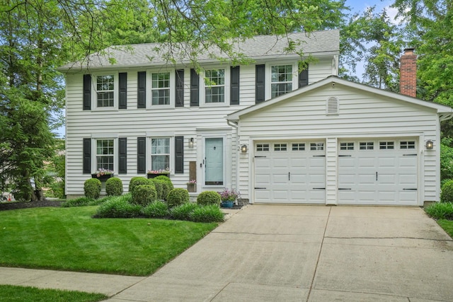 712 Suntree Dr, Westerville, OH 43081 - colonial inspired home with concrete driveway, a front yard, and an attached garage