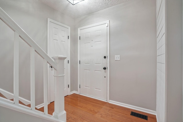 712 Suntree Dr, Westerville, OH 43081 - foyer with light wood-style flooring and stairs