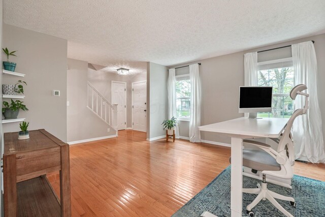 712 Suntree Dr, Westerville, OH 43081 - office with light wood-style floors and a textured ceiling