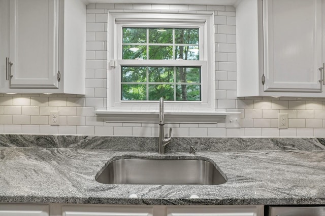 712 Suntree Dr, Westerville, OH 43081 - kitchen featuring backsplash, stone counters, and white cabinets