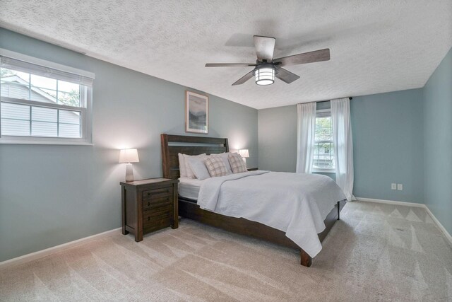 712 Suntree Dr, Westerville, OH 43081 - bedroom featuring carpet floors, a textured ceiling, and ceiling fan