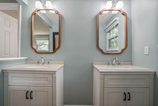 712 Suntree Dr, Westerville, OH 43081 - full bathroom featuring two vanities and healthy amount of natural light