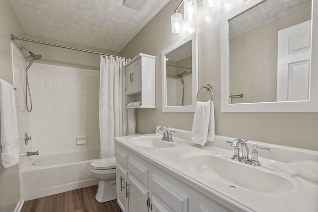 712 Suntree Dr, Westerville, OH 43081 - full bathroom with a textured ceiling, shower / bath combo, wood finished floors, and double vanity