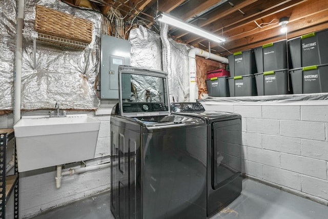 712 Suntree Dr, Westerville, OH 43081 - laundry area with washer and dryer, electric panel, and concrete block wall