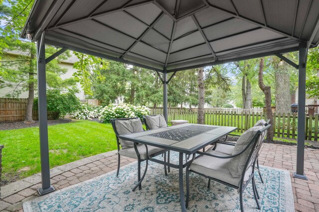 712 Suntree Dr, Westerville, OH 43081 - fenced backyard featuring a patio area, outdoor dining area, and a gazebo