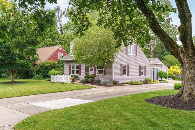 2006 Kentwell Rd, Upper Arlington, OH 43221 - view of property hidden behind natural elements with a front lawn, a chimney, and roof with shingles