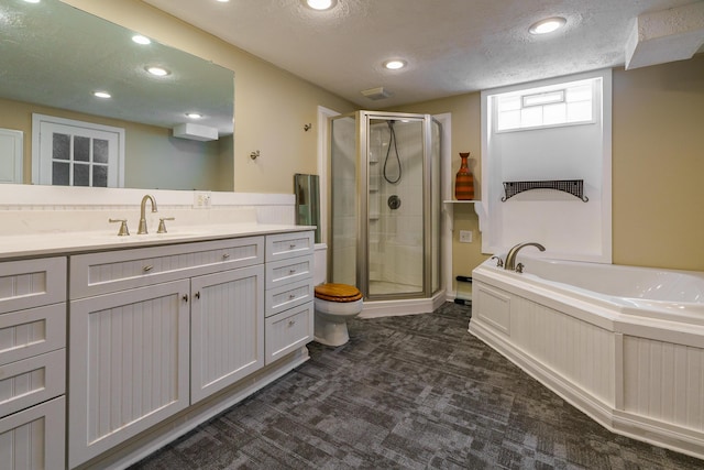 2006 Kentwell Rd, Upper Arlington, OH 43221 - bathroom featuring a stall shower, a garden tub, vanity, a textured ceiling, and recessed lighting