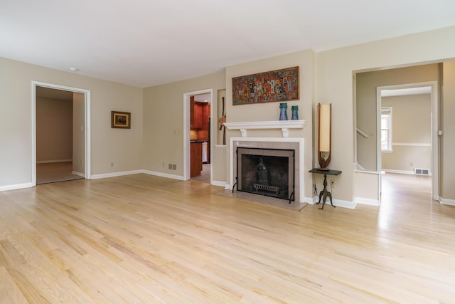 2006 Kentwell Rd, Upper Arlington, OH 43221 - unfurnished living room with light wood-style floors and a fireplace