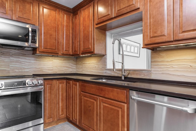 2006 Kentwell Rd, Upper Arlington, OH 43221 - kitchen with appliances with stainless steel finishes, dark countertops, brown cabinetry, and decorative backsplash
