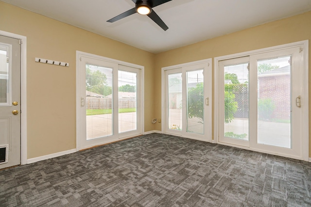 2006 Kentwell Rd, Upper Arlington, OH 43221 - spare room with dark colored carpet, healthy amount of natural light, and a ceiling fan