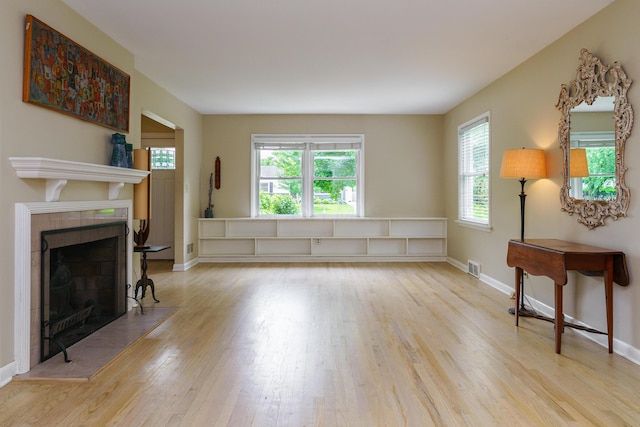 2006 Kentwell Rd, Upper Arlington, OH 43221 - living room featuring wood finished floors, a fireplace, and healthy amount of natural light