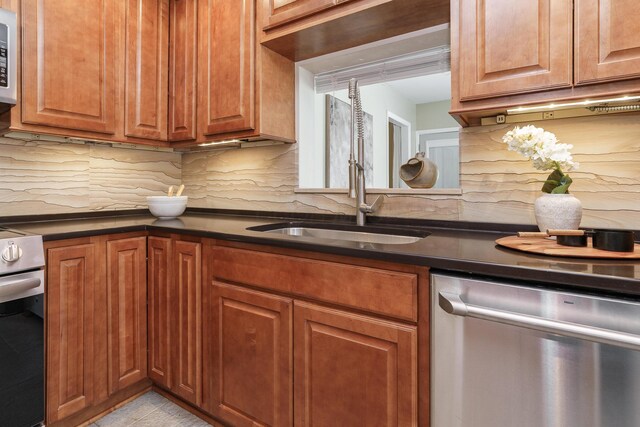 2006 Kentwell Rd, Upper Arlington, OH 43221 - kitchen with dishwasher, stove, backsplash, dark countertops, and white microwave