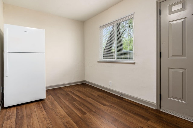 437-441 S Glenwood Ave, Columbus, OH 43223 - unfurnished dining area featuring dark wood-style flooring and baseboards