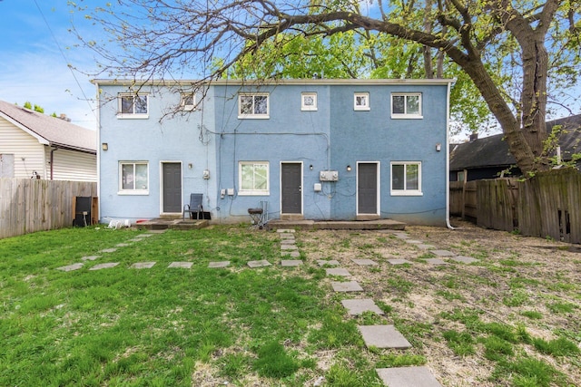 437-441 S Glenwood Ave, Columbus, OH 43223 - back of house featuring a fenced backyard and stucco siding