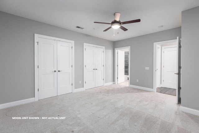 5177 Highpointe Lakes Dr Unit 9102, Westerville, OH 43081 - unfurnished bedroom with two closets, carpet flooring, and a ceiling fan