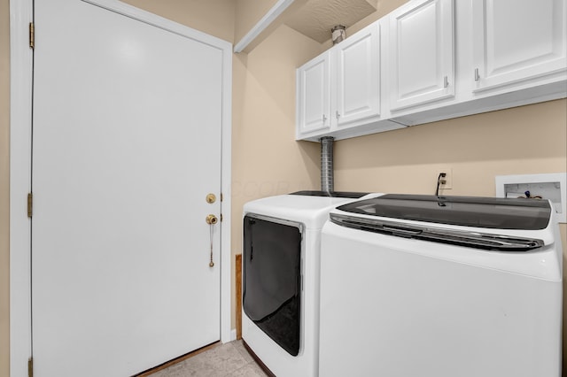 595 Piney Glen Dr, Columbus, OH 43230 - laundry room with washing machine and clothes dryer, cabinet space, and light tile patterned floors
