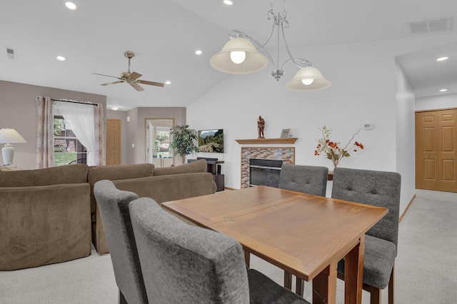 595 Piney Glen Dr, Columbus, OH 43230 - dining room featuring recessed lighting, ceiling fan, light carpet, lofted ceiling, and a stone fireplace