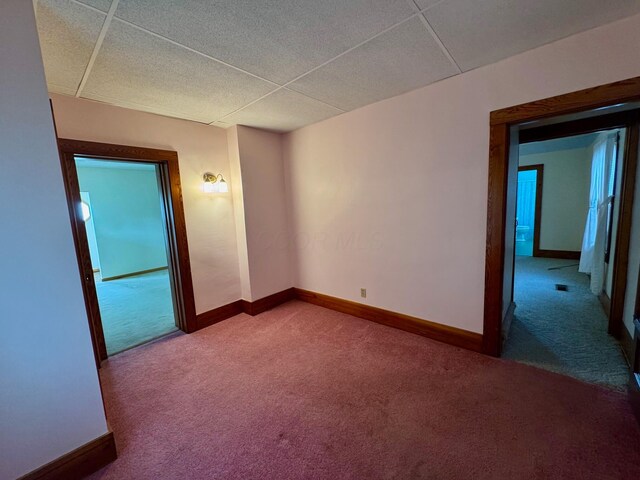 181 W 3rd St, Frazeysburg, OH 43822 - carpeted spare room featuring baseboards and a paneled ceiling