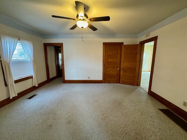 181 W 3rd St, Frazeysburg, OH 43822 - empty room with a ceiling fan and carpet floors