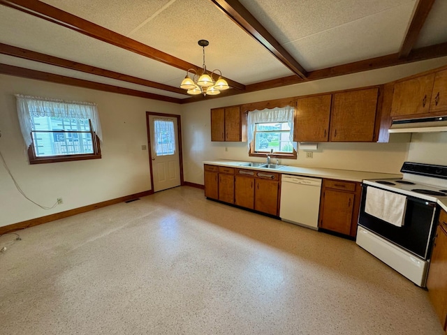 181 W 3rd St, Frazeysburg, OH 43822 - kitchen with white appliances, brown cabinetry, under cabinet range hood, beam ceiling, and light countertops