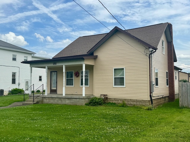 181 W 3rd St, Frazeysburg, OH 43822 - rear view of property featuring covered porch and a shingled roof