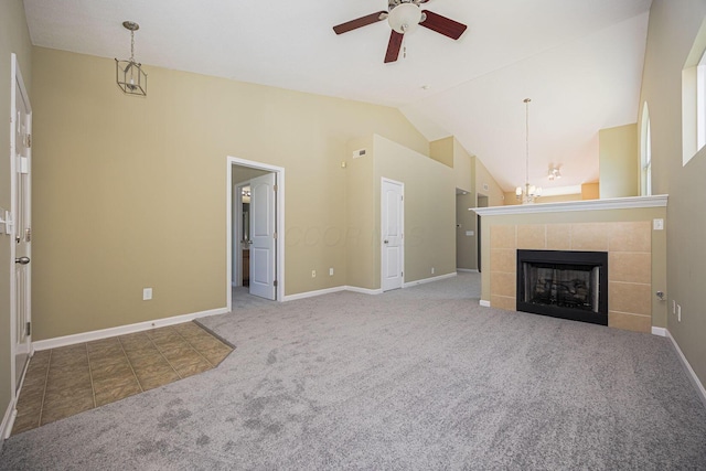 5654 Caledonia Dr, Westerville, OH 43081 - unfurnished living room featuring ceiling fan, carpet, lofted ceiling, a fireplace, and a chandelier
