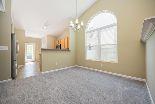 5654 Caledonia Dr, Westerville, OH 43081 - carpeted spare room with a chandelier and vaulted ceiling