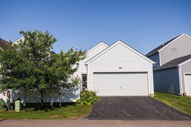 5654 Caledonia Dr, Westerville, OH 43081 - view of front of house featuring asphalt driveway and an attached garage