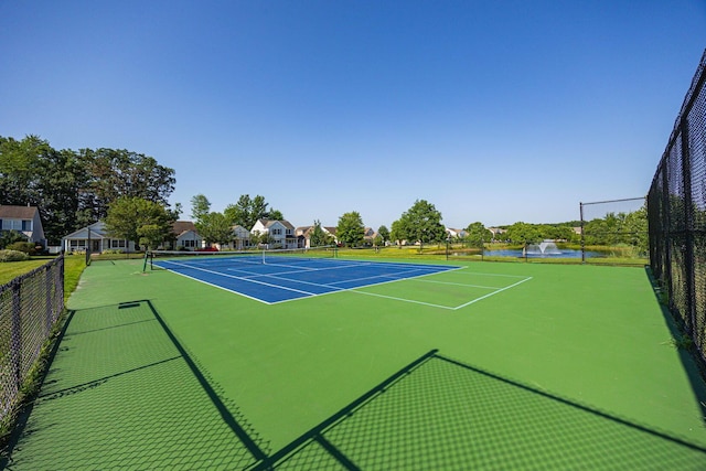 5654 Caledonia Dr, Westerville, OH 43081 - view of tennis court featuring a water view