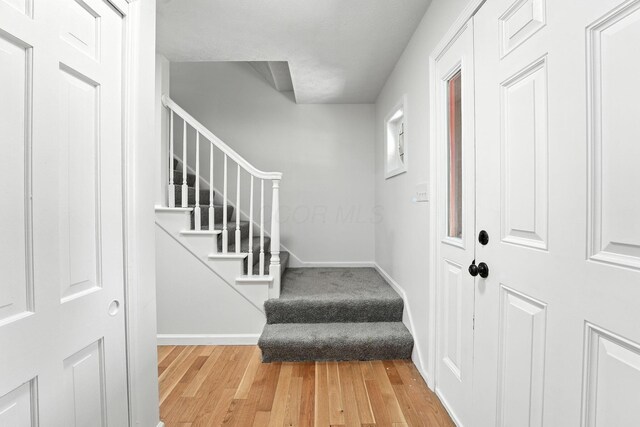 1360 Langston Dr, Columbus, OH 43220 - entrance foyer with wood finished floors and stairs