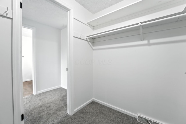 1360 Langston Dr, Columbus, OH 43220 - walk in closet with carpet floors and baseboard heating